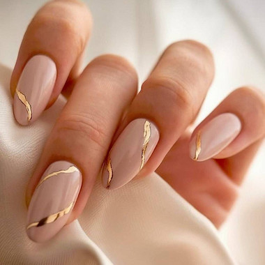Nude manicure with gold lines