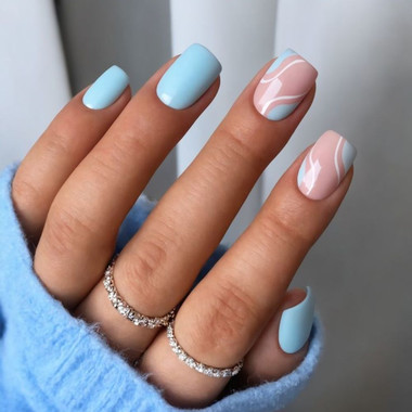 Gentle blue manicure with abstraction