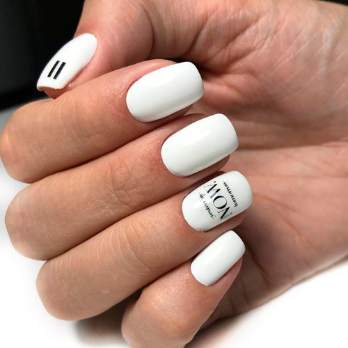 Manicure with inscriptions (White manicure)