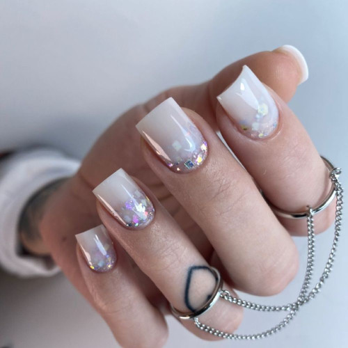 Milky manicure with glitter