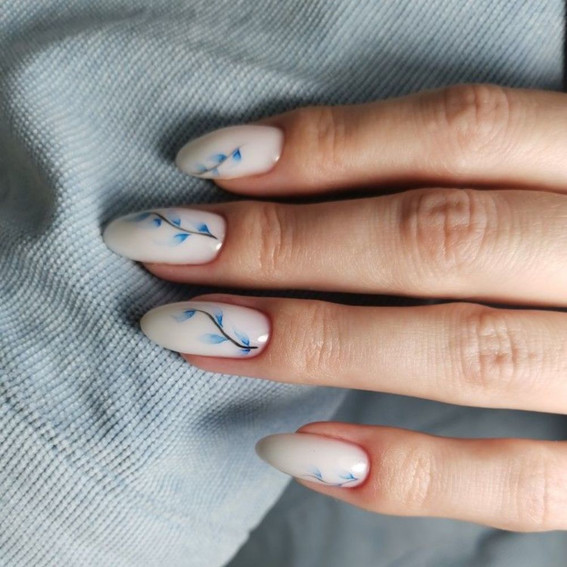 Manicure with blue branches