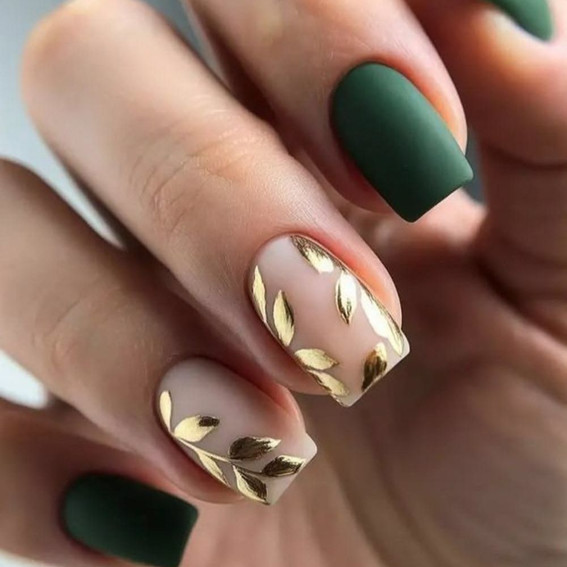Autumn manicure with gold leaves