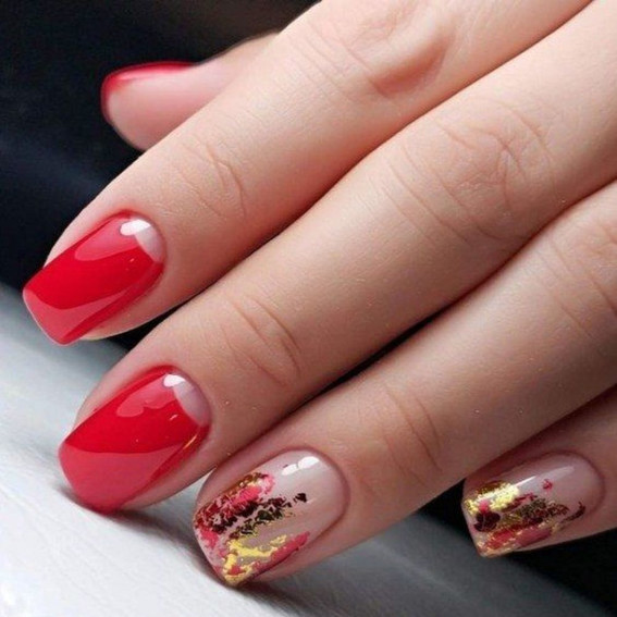 Red manicure with a transparent effect and gold decor